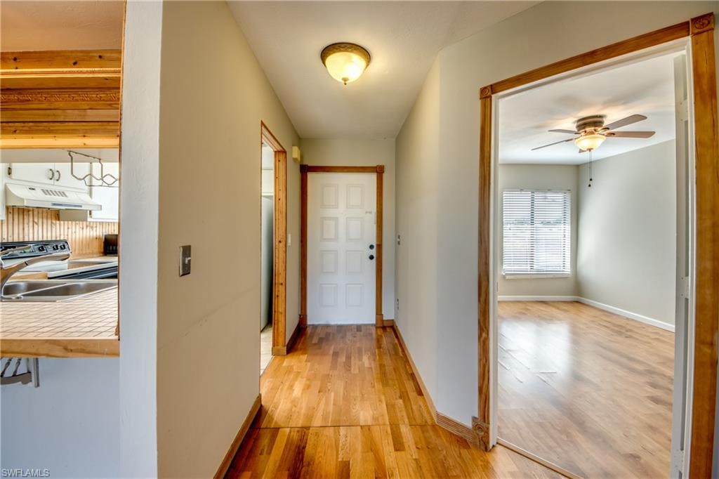 Hallway featuring light wood-type flooring