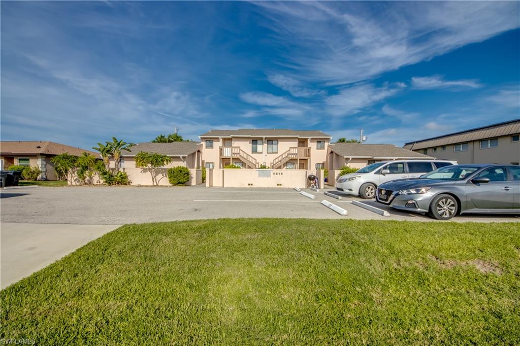 View of front of property with a front yard