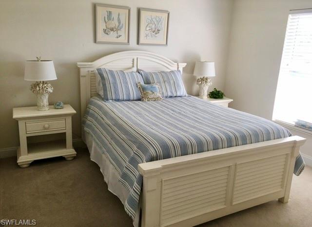 White-painted bed frame with louvered details