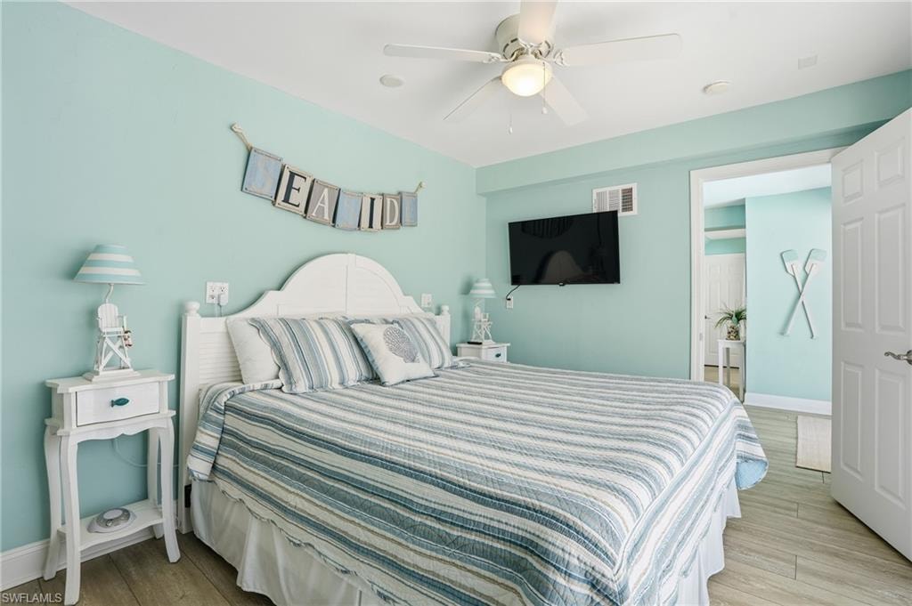 Light blue walls with wood-finish flooring