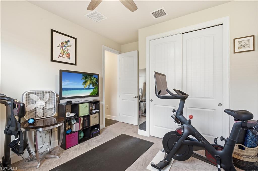 Neutral wall color, ceiling fan, recessed lighting, and carpeted flooring
