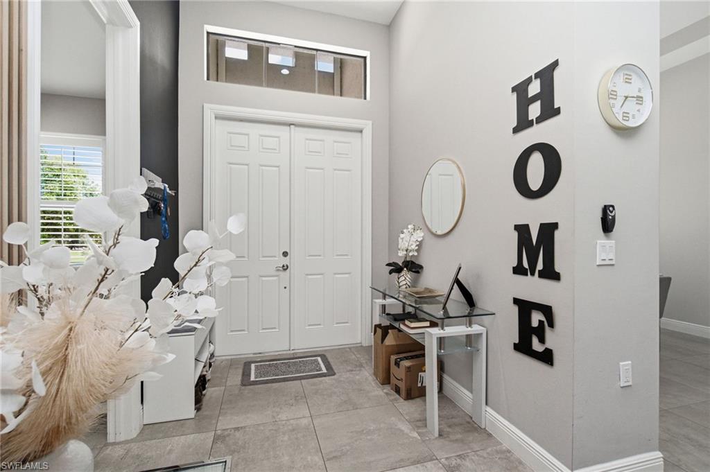 Double front doors with transom window