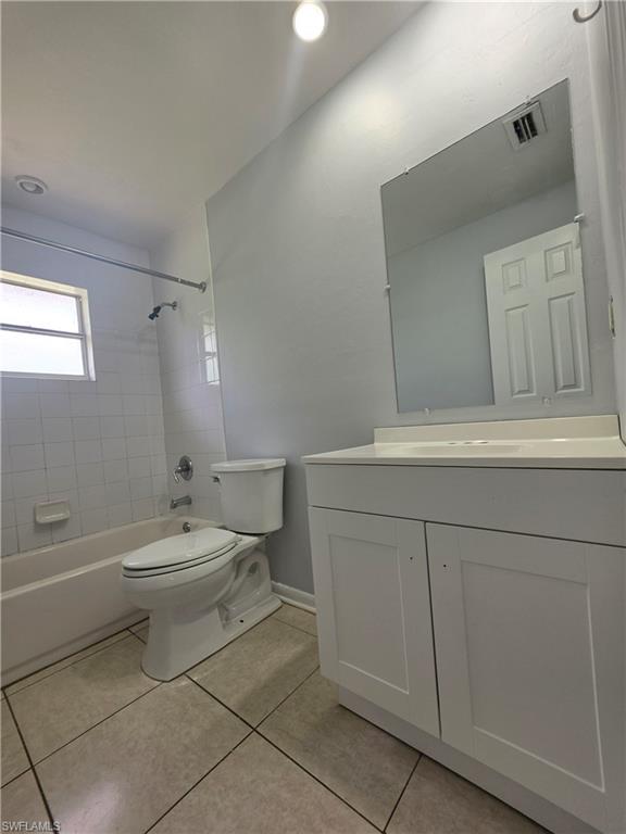 Tile flooring with matching wall tile in the bath area