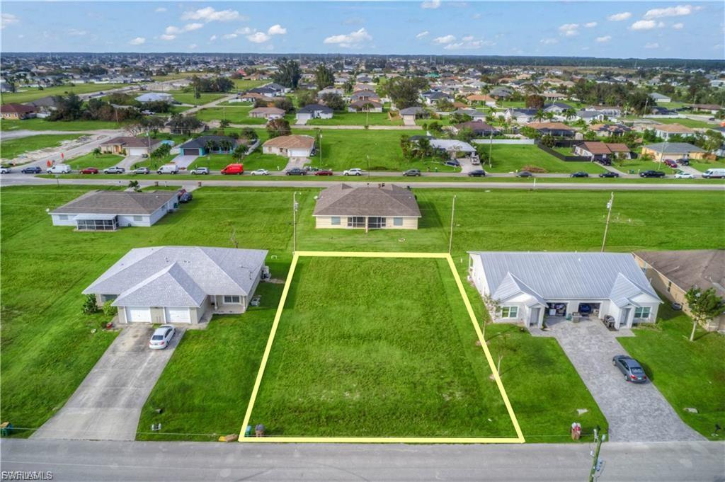 Aerial perspective of suburban area featuring property parcel outlined