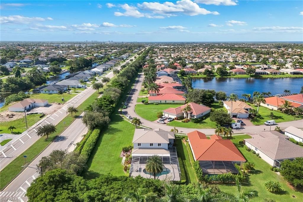 Aerial perspective of a developed residential area featuring various single-story homes