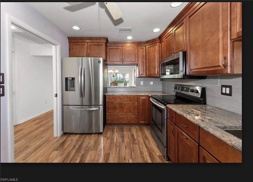 SS appliances, Granite Counter tops, allconvey backsplash,,wood color cabinets