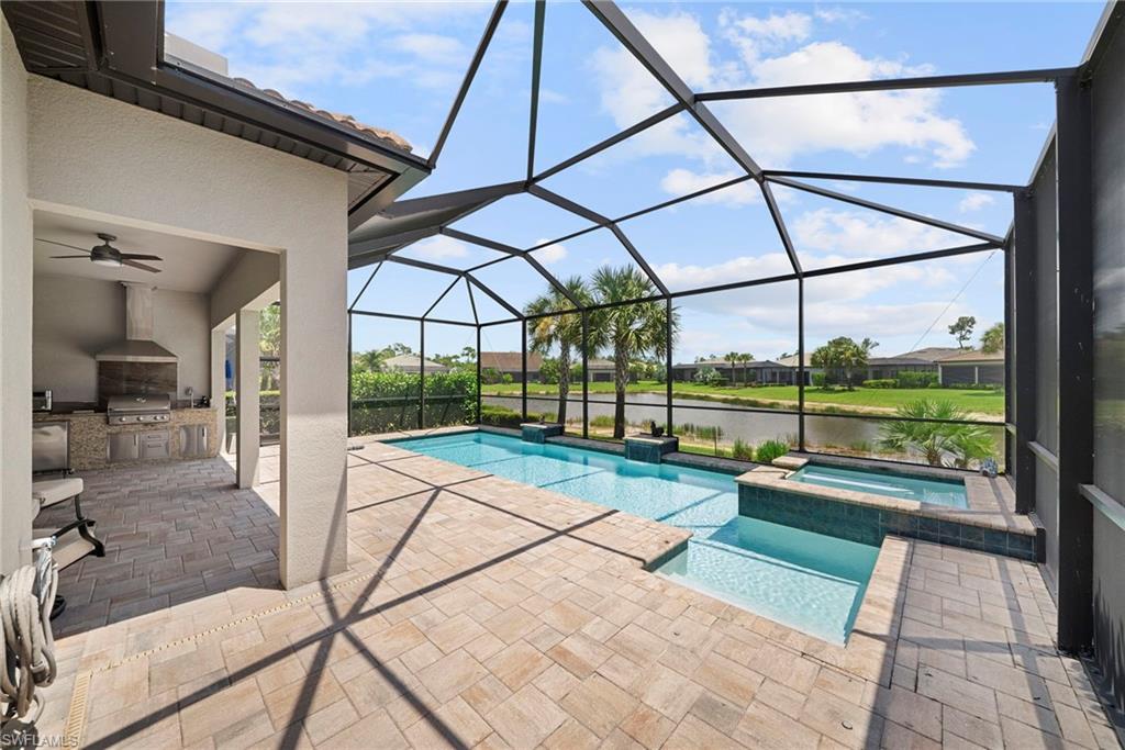 Southern lake view, custom saltwater pool & spa, outdoor summer kitchen