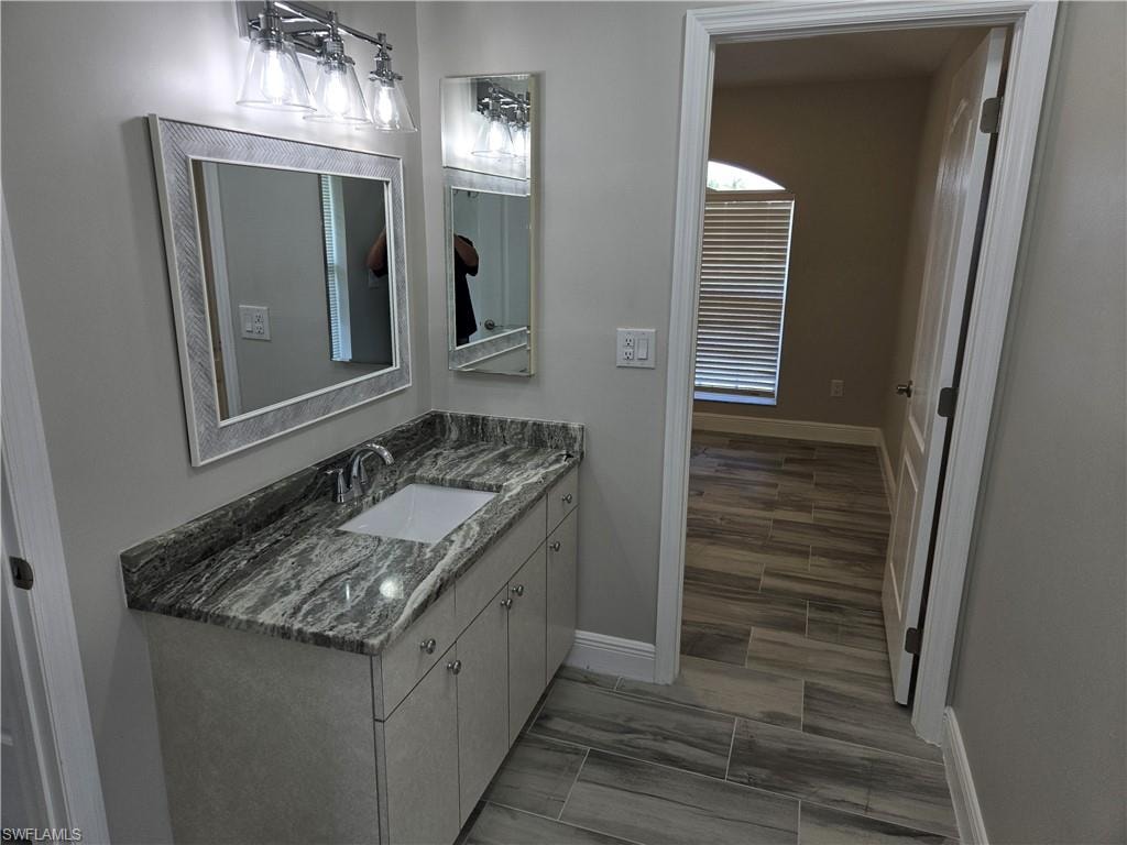 Bathroom with baseboards and vanity