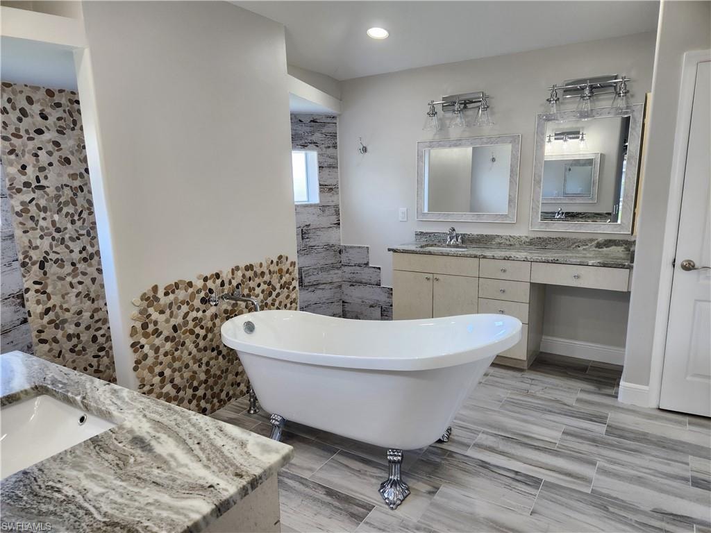 Bathroom with vanity and a freestanding bath