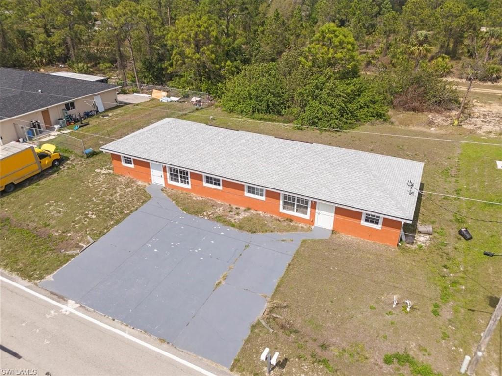 Drone / aerial view with a wooded view