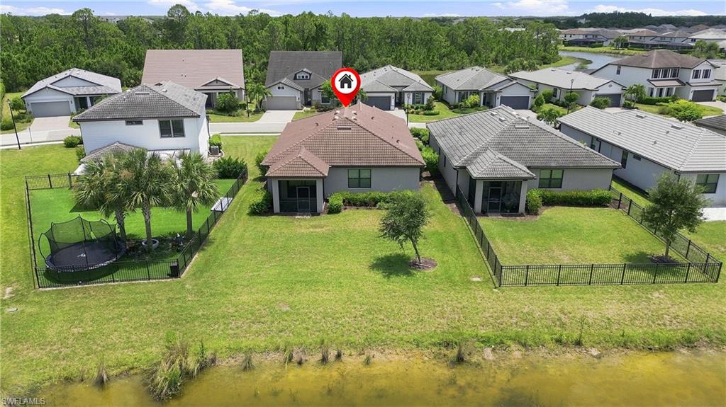 Waterfront home situated on expansive grounds with mature landscaping and manicured lawn