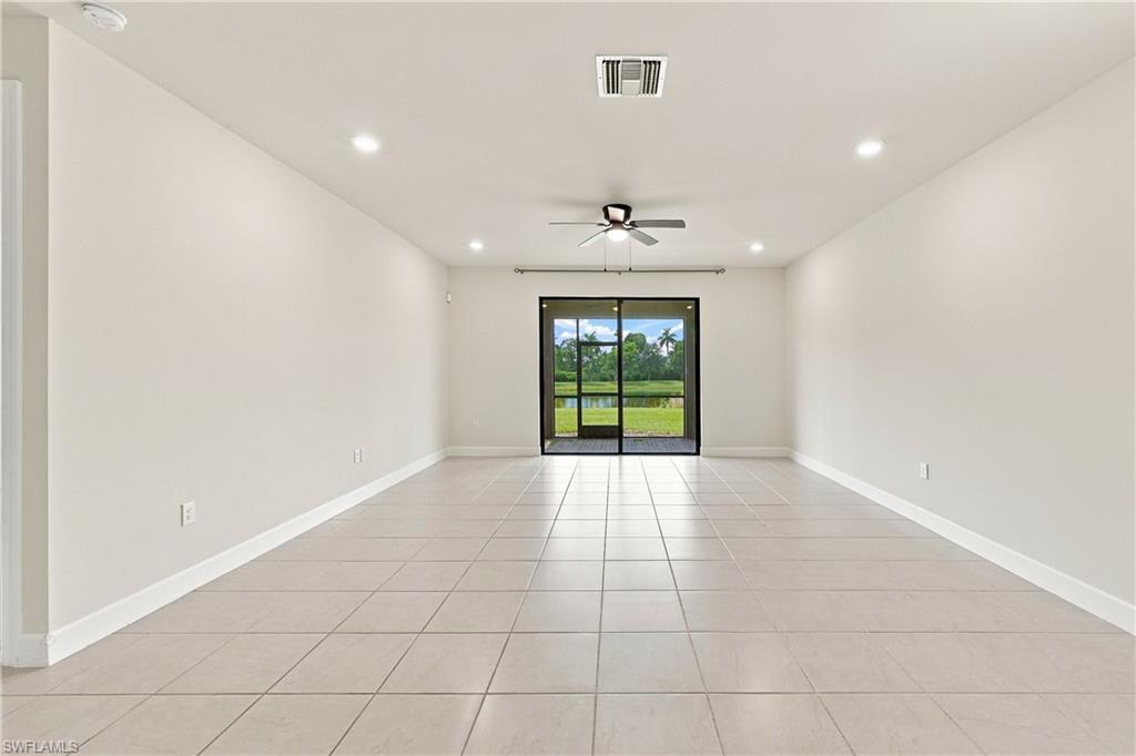 Recessed ceiling lighting, ceiling fan, sliding glass doors, screened patio, and tile flooring