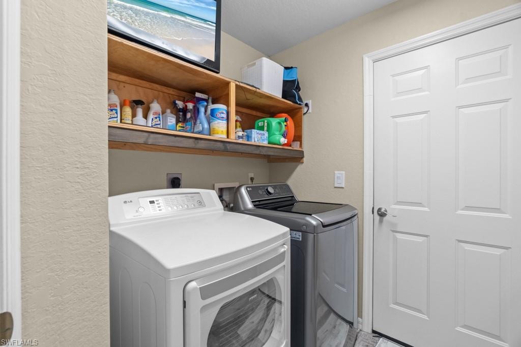 Dedicated laundry area with open shelving and a paneled door