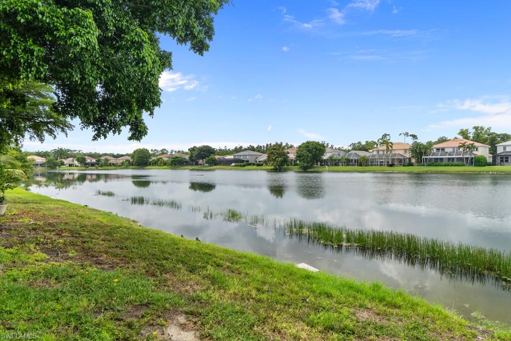 Waterside property with a grassy bank and established trees
