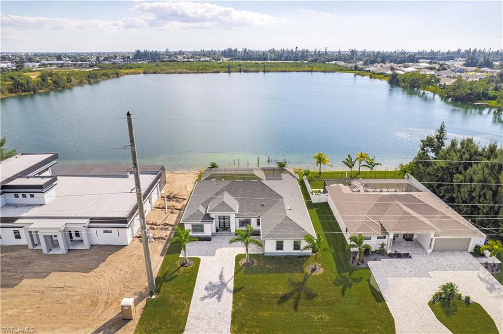 Aerial view of residential area featuring a large body of water