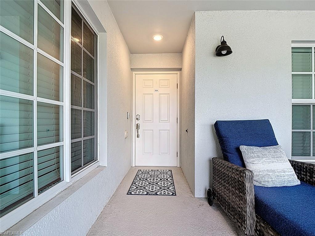 Property entrance featuring stucco siding