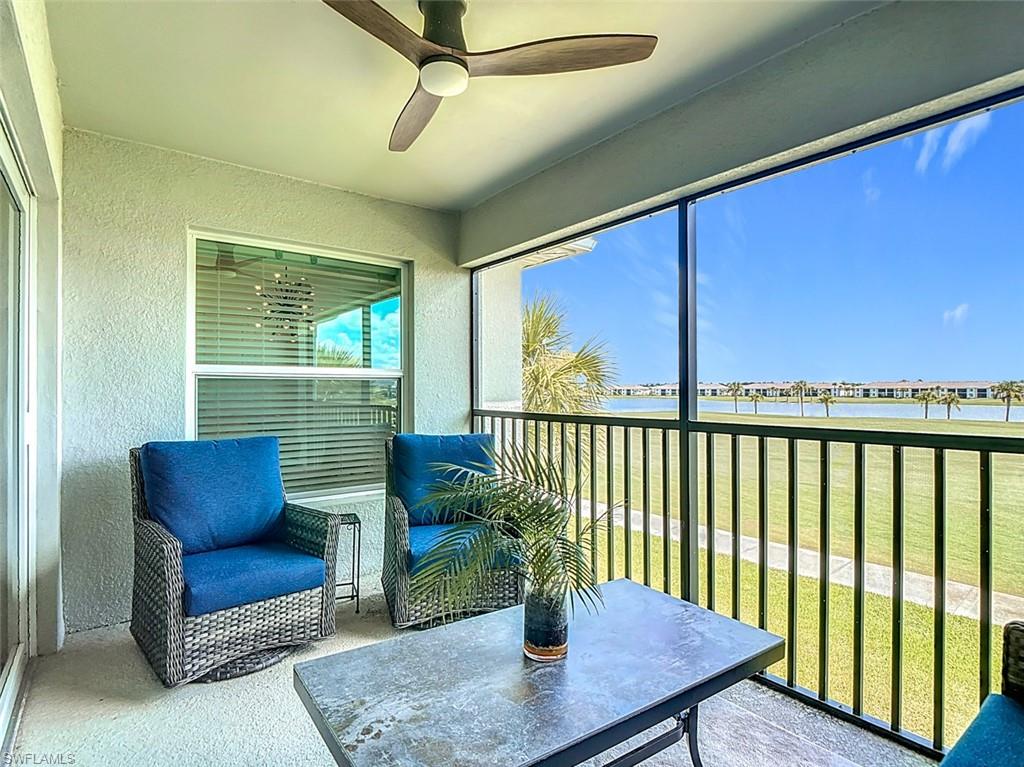 Sunroom featuring a water view