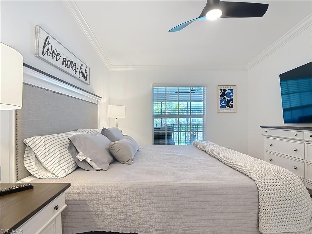Bedroom featuring crown molding and ceiling fan