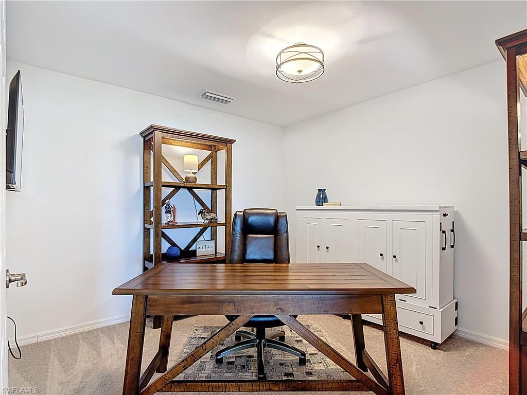 Office space featuring light colored carpet
