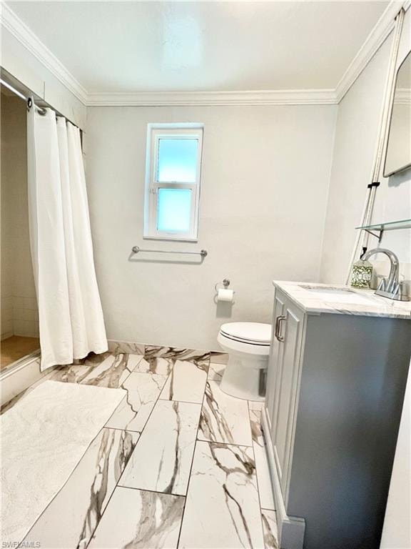 Modern bathroom featuring a single window, crown molding, and a gray vanity with a countertop