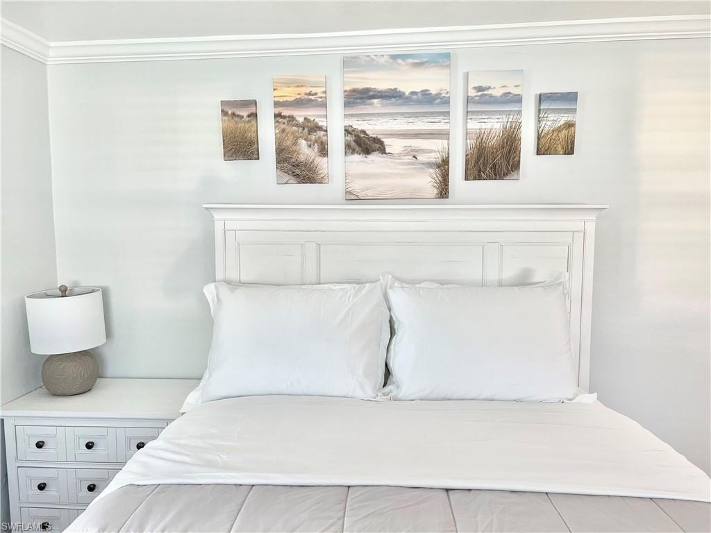 White paneled headboard and crown molding