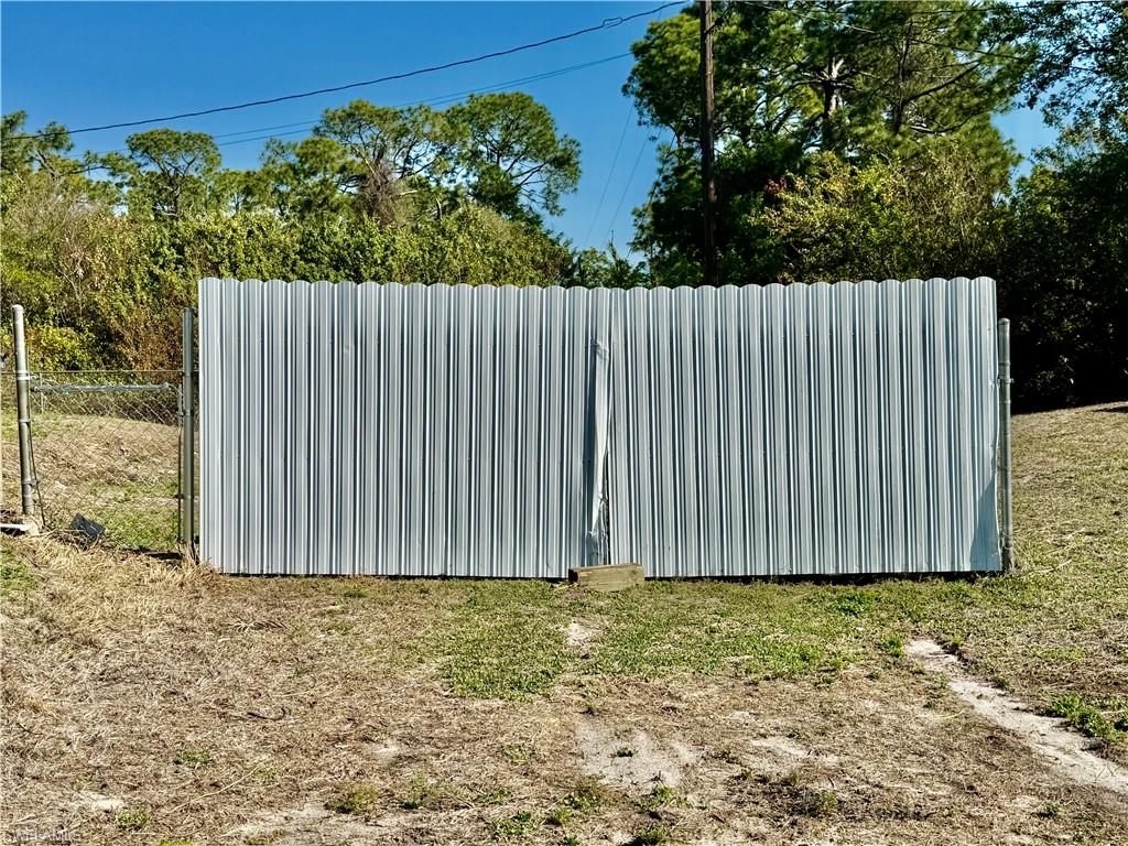 Double gate to backyard.