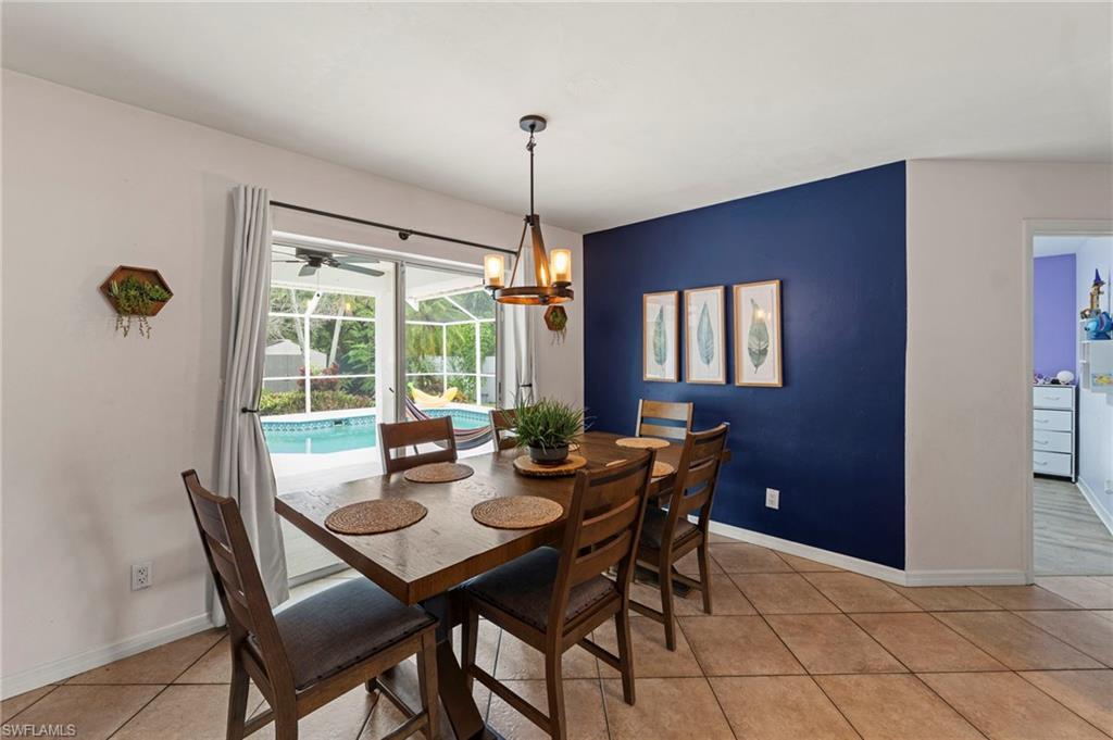 Tiled flooring throughout, with a striking blue accent wall