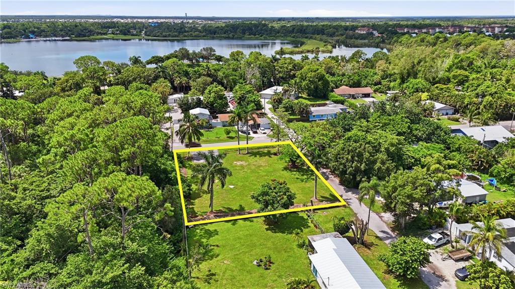 Expansive green space featuring mature trees and a clear perimeter