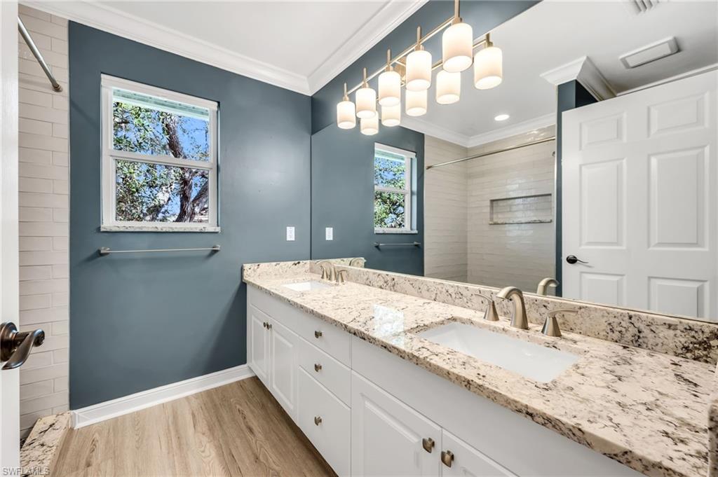 Dual vanity with stone-finish countertops and integrated sinks