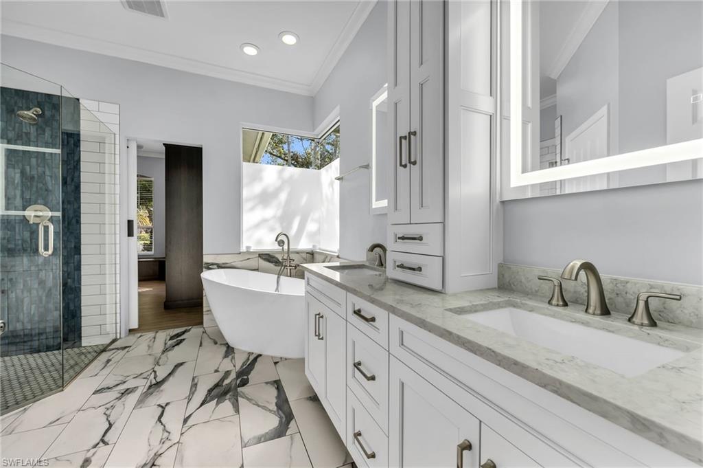 Dual vanity with undermount sinks and light-toned countertops