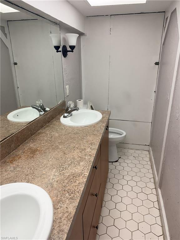 Double vanity with integrated sinks and stone-finish countertop