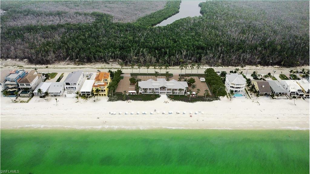 Waterfront residence with direct beach access overlooking pristine coastal waters