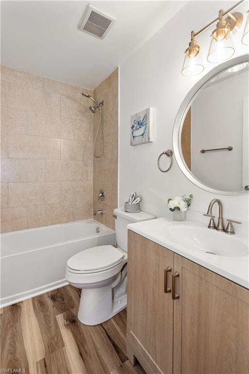 Tiled tub/shower combination, wood-finish flooring, single vanity with a white countertop, round wall-mounted mirror, and a three-light fixture
