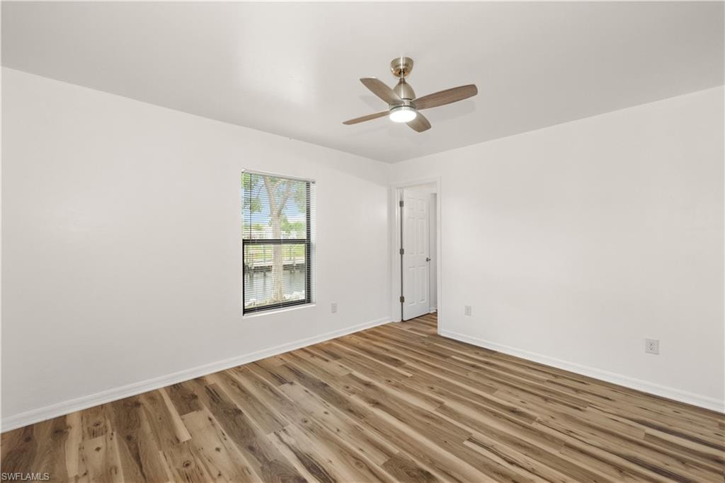 Wood-finish flooring with white baseboards
