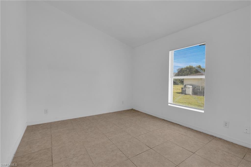 Tile flooring and a white-framed window with horizontal blinds