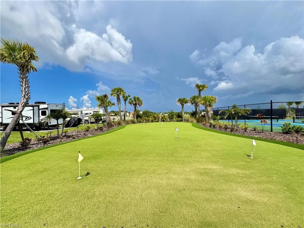 Putting green with multiple flag positions and artificial turf
