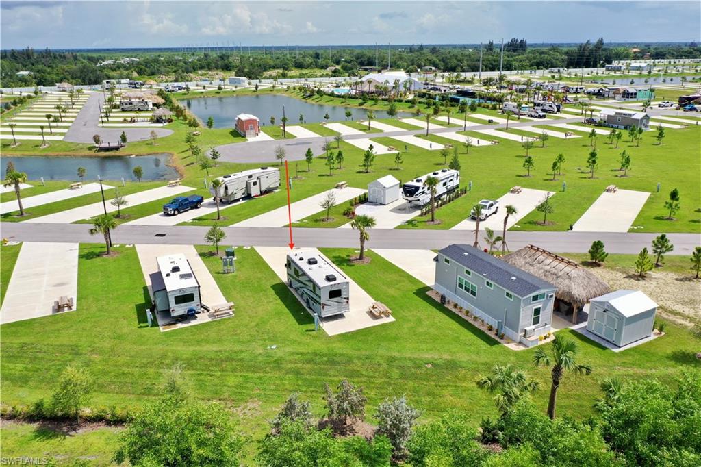 Manicured green spaces with mature trees and multiple developed water features