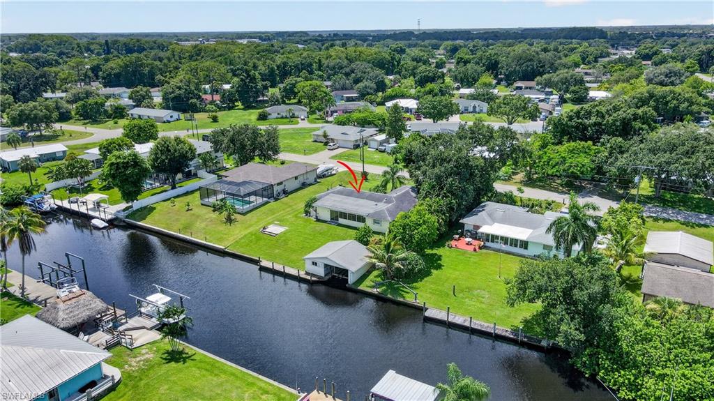 Waterfront property featuring a private boat lift and dock access
