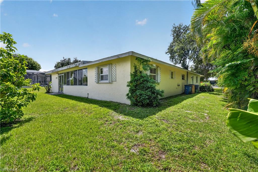 Expansive green lawn surrounds the property