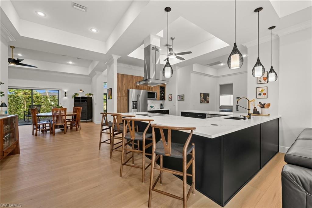 Custom lighting, tray ceilings and crown molding all through the home
