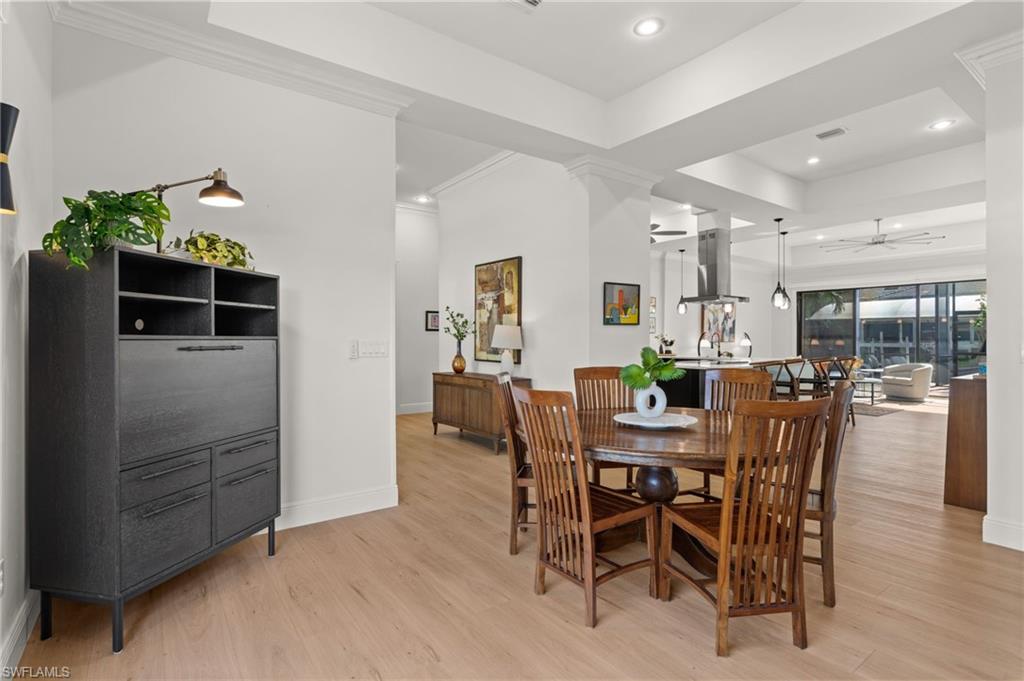 From the living room, through dining, toward the kitchen, family room, pool and water