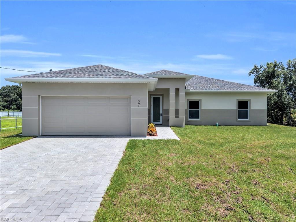 Lovely Brand New 3 Bedroom (Plus Private Home Office/Den/Or 4th Bedroom) 2 Bathroom/2 Car Garage Home On An Oversized 1/2 Acre Lot In Lehigh Acres, FL!
