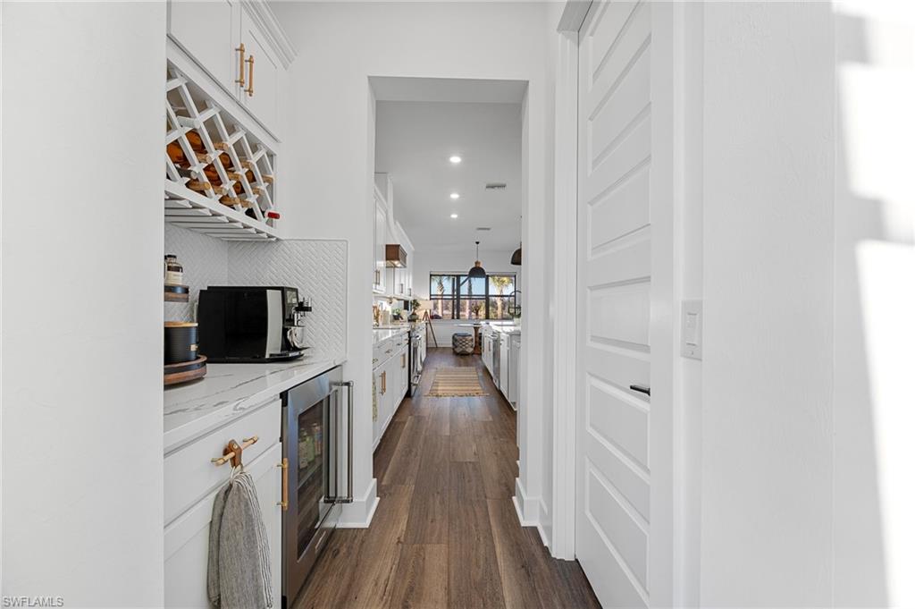 Wine bar/entertainment area between formal dining room and kitchen.  Walk in pantry through door on left.