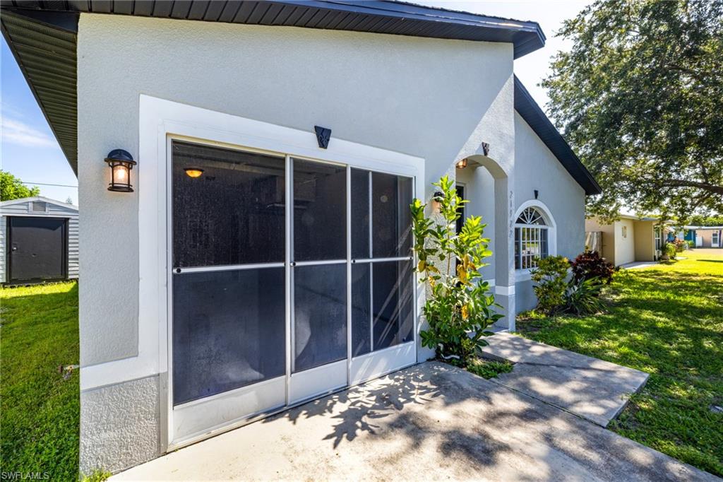 Garage has a sliding screen door for added space