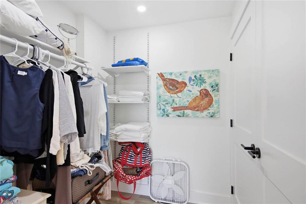 Adjustable shelving system with a white finish