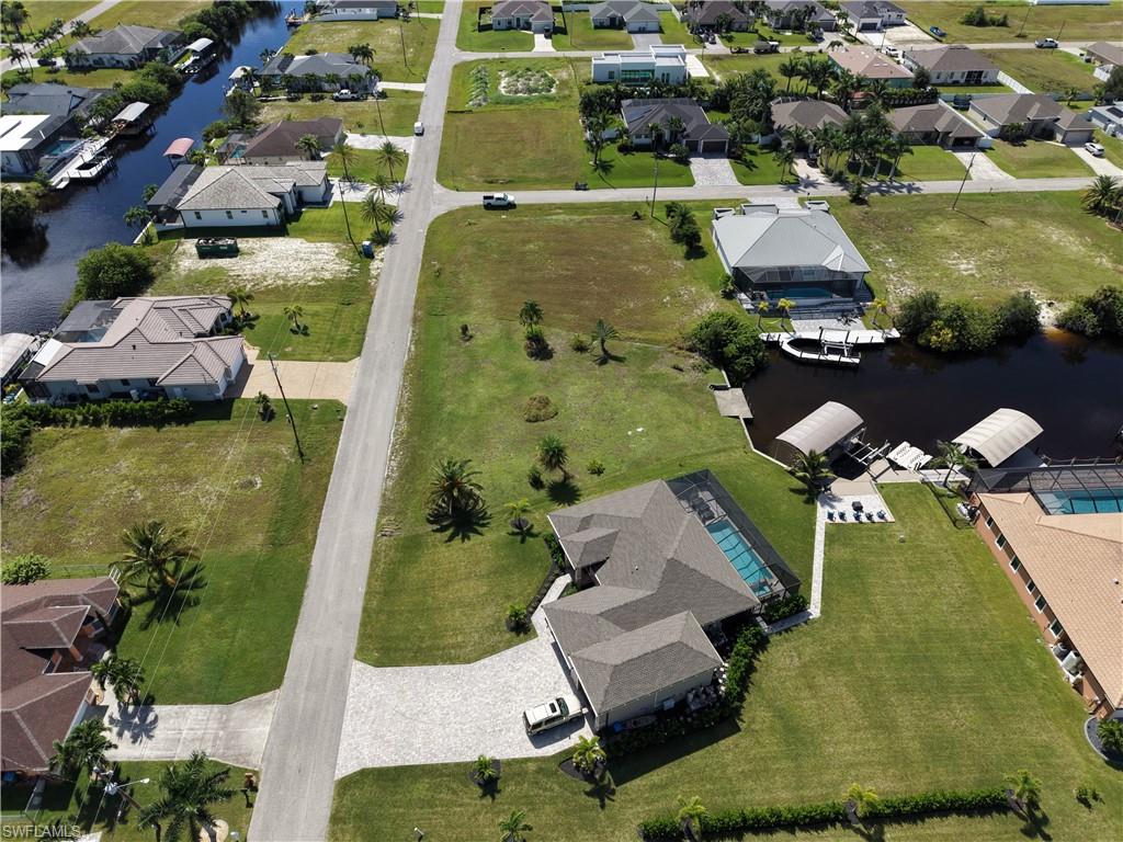 Waterfront property with boat access, boat dock, and covered boat lifts