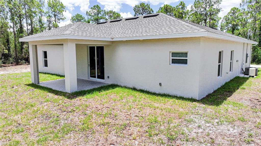 Awesome Back Yard With Penty Of Room For A Pool And It Comes With A Palm Tree! The Covered Lanai Comes With An Epoxy Floor Coating!