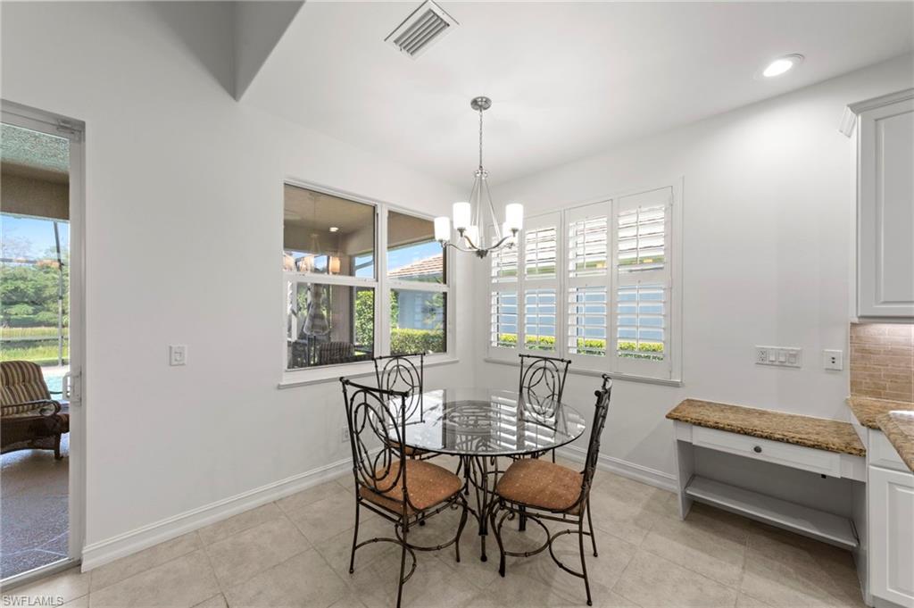 Recessed lighting, tiled flooring, plantation shutters, built-in cabinetry, and a sliding glass door