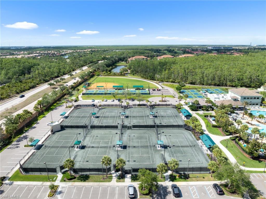 Multiple tennis courts, dedicated parking, adjacent recreational fields, extensive landscaping, and a nearby aquatic facility