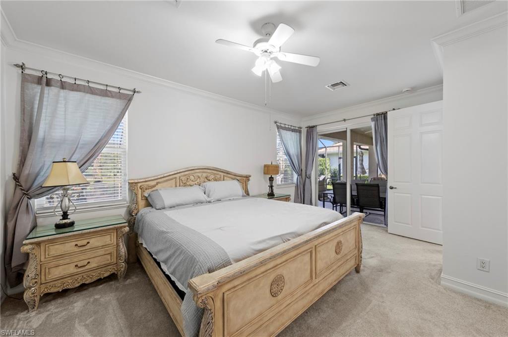 Crown molding accentuates the ceiling with a ceiling fan